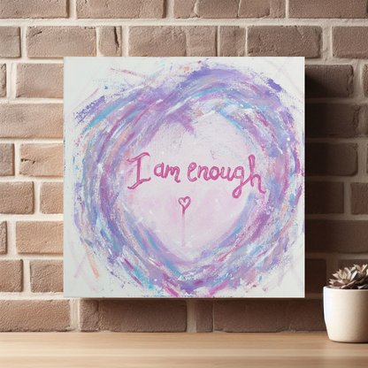 I Am Enough canvas print by Julie Hogarth-Jones shown on a brick wall with shelf and small plant.