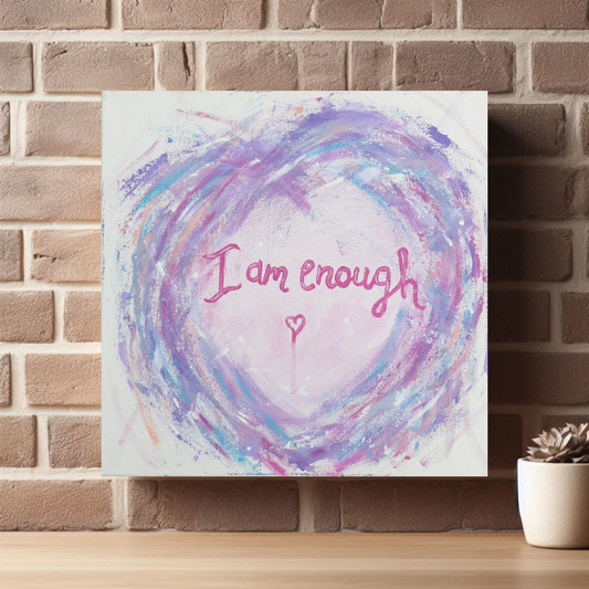 I Am Enough canvas print by Julie Hogarth-Jones shown on a brick wall with shelf and small plant.